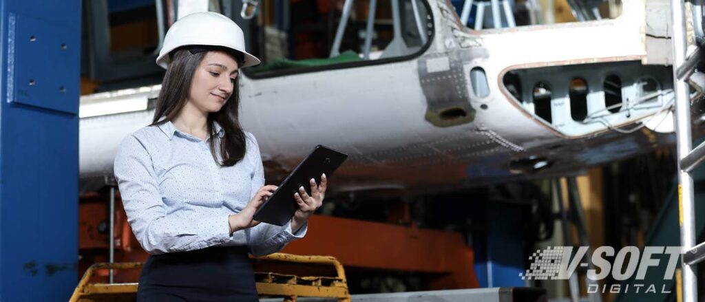 Woman in manufacturing holding a tablet