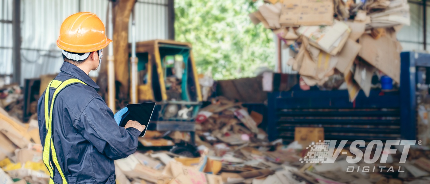 Engineer Standing to work with tablet Machines in the recycling industry